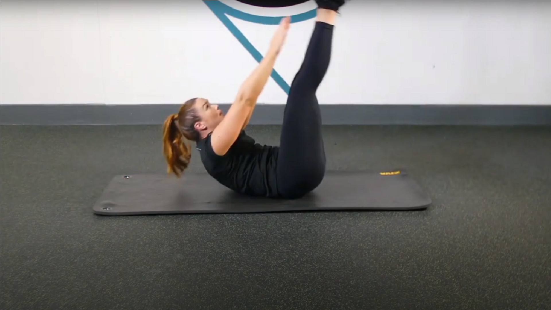 Get flatter abs with the V-sit exercise